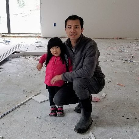 Jack Lin of Scale Design+Build with his daughter on a job site during construction
